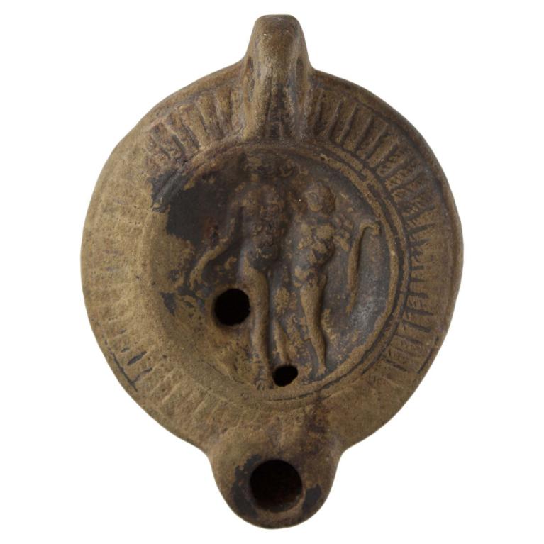 Bacchus, debout au centre, tient de la main droite un vase renversé et pose son bras gauche sur l'épaule d'un personnage qui tient un pedum. D. 95 x 72 x 24 mm Acquisition SVV Millon et Associés, Paris, France. Provenance inconnue. Voir fiche N° 20141121 135 Bacchus, debout au centre, tient de la main droite un vase renversé et pose son bras gauche sur l'épaule d'un personnage qui tient un pedum. D. 95 x 72 x 24 mm Acquisition SVV Millon et Associés, Paris, France. Provenance inconnue. Voir fiche N° 20141121 135