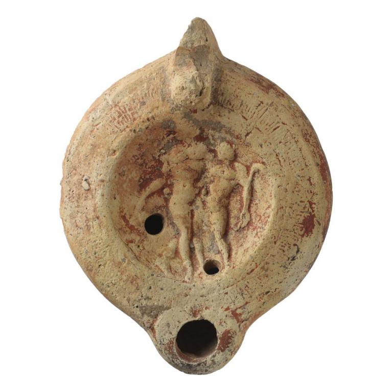 Bacchus, debout au centre, tient de la main droite un vase renversé et pose son bras gauche sur l'épaule d'un personnage qui tient un pedum. Marque de potier D. 106 x 81 x 29 mm Acquisition SVV Est Enchères, Metz, France. Provenance inconnue. N° 20170121 001 Bacchus, debout au centre, tient de la main droite un vase renversé et pose son bras gauche sur l'épaule d'un personnage qui tient un pedum. Marque de potier D. 106 x 81 x 29 mm Acquisition SVV Est Enchères, Metz, France. Provenance inconnue. N° 20170121 001